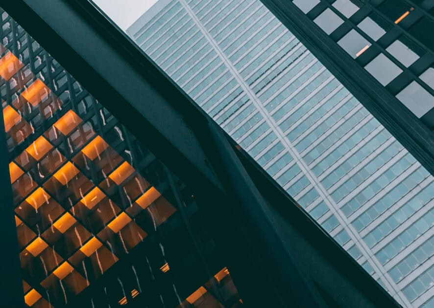 Abstract view of modern skyscrapers, showcasing architectural design. Government solutions. - Global Trade Data