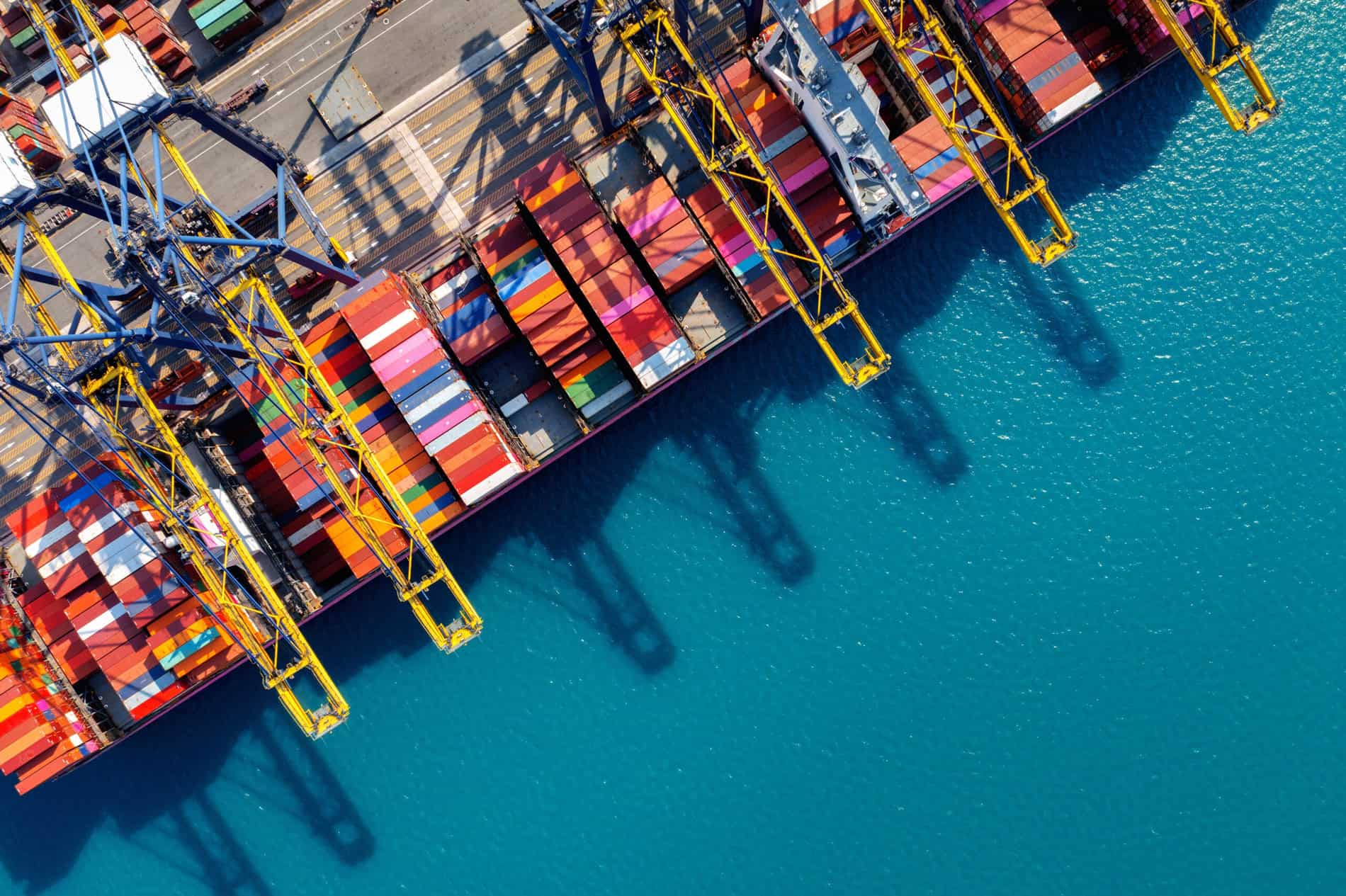 Efficiently Planning Shipments | Monitoring Port Schedules | Timely Loading and Unloading | Accurate Schedule Information | Minimize Wait Times | Avoid Costly Delays | Supply Chain Efficiency | Join the Waitlist Button | Overhead View of Cargo Ships and Containers at Port | ADAMftd Efficiently Planning Shipments | Monitoring Port Schedules | Timely Loading and Unloading | Accurate Schedule Information | Minimize Wait Times | Avoid Costly Delays | Supply Chain Efficiency | Join the Waitlist Button | Overhead View of Cargo Ships and Containers at Port | ADAMftd